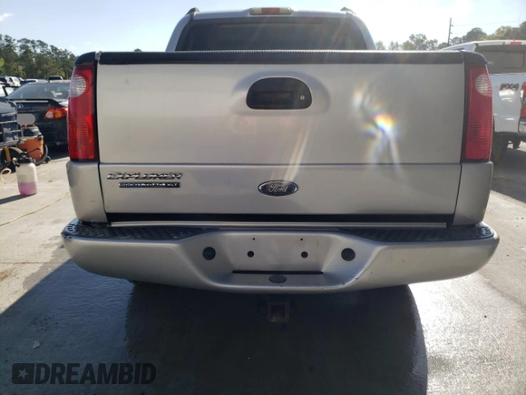 2004 Ford Explorer Sport Trac XLS with VIN 1FMZU67K24UB65144, listed as a Copart auction lot 52611305 with 211,806 mi miles and Salvage title. Bid and sale history available at DreamBid. Image 6.