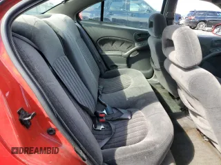 1999 Pontiac Grand Am GT1 with VIN 1G2NW52E5XM768638, listed as a Copart auction lot 49077115 with 113,018 mi miles and Salvage Title. Bid and sale history available at carsss.com. Image 10.