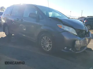 2014 Toyota Sienna XLE with VIN 5TDYK3DC8ES409922, listed as a IAAI auction lot 41020338 with 239,065 mi miles. Bid and sale history available at carsss.com. Image 1.