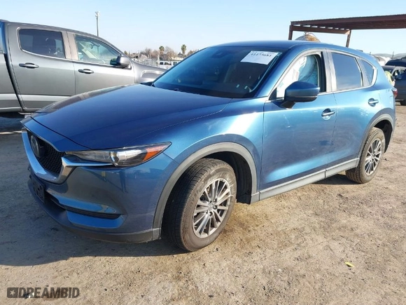 2019 Mazda CX-5 Touring with VIN JM3KFACM1K0517958, listed as a IAAI auction lot 41473681 with NaN miles. Bid and sale history available at carsss.com. Image 2.