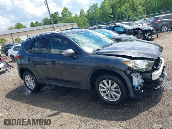 2015 Mazda CX-5 Touring with VIN JM3KE4CY9F0506879, listed as a IAAI auction lot 42209768 with 87,690 mi miles and . Bid and sale history available at DreamBid. Image 14.