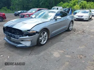 2021 Ford Mustang EcoBoost z VIN 1FA6P8TH1M5121107, wystawiony jako IAAI lot #42204097 z przebiegiem 51 542 mil mil oraz . Historia ofert i sprzedaży dostępna na DreamBid. Obrazek 18.