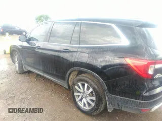 2021 Honda Pilot EX-L with VIN 5FNYF5H50MB011165, listed as a IAAI auction lot 39799892 with 95,040 mi miles and . Bid and sale history available at DreamBid. Image 14.