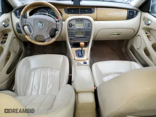 2004 Jaguar X-Type with VIN SAJEA51C84WD57149, listed as a Copart auction lot 82661344 with 146,574 mi miles and Salvage Title. Bid and sale history available at carsss.com. Image 8.