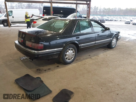 1997 Cadillac Seville Luxury SLS with VIN 1G6KS52YXVU816736, listed as a IAAI auction lot 41854220 with 107,091 mi miles. Bid and sale history available at carsss.com. Image 4.