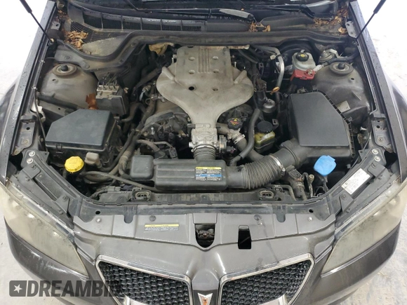 2009 Pontiac G8 z VIN 6G2ER57769L192376, wystawiony jako Copart lot #58634365 z przebiegiem 206 095 mil mil oraz Tytuł czysty. Historia ofert i sprzedaży dostępna na DreamBid. Obrazek 11.