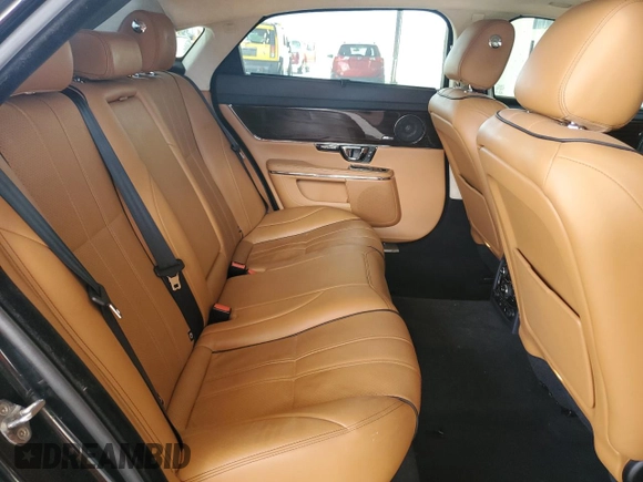 2014 Jaguar XJ Portfolio z VIN SAJWA2GZ4E8V60864, wystawiony jako Copart lot #76478674 z przebiegiem 50 578 mil mil oraz Szkoda całkowita • Salvage title. Historia ofert i sprzedaży dostępna na DreamBid. Obrazek 10.
