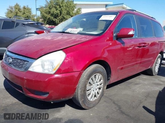 2012 Kia Sedona LX with VIN KNDMG4C70C6443649, listed as a IAAI auction lot 41662007 with 208,575 mi miles. Bid and sale history available at carsss.com. Image 2.