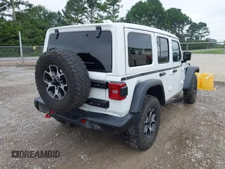 2021 Jeep Wrangler Unlimited Rubicon with VIN 1C4JJXFM9MW774142, listed as a IAAI auction lot 42625007 with 42,318 mi miles and . Bid and sale history available at DreamBid. Image 6.