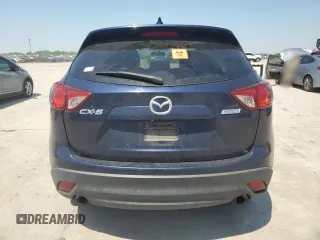 2014 Mazda CX-5 Touring z VIN JM3KE2CYXE0327950, wystawiony jako Copart lot #51390585 z przebiegiem 129 523 mil mil oraz Czysty tytuł • Clean title. Historia ofert i sprzedaży dostępna na DreamBid. Obrazek 6.