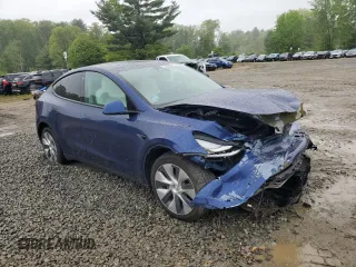 2022 Tesla Model Y Long Range z VIN 7SAYGDEE6NF318808, wystawiony jako Copart lot #57219915 z przebiegiem Nie podano mil oraz Szkoda całkowita • Salvage title. Historia ofert i sprzedaży dostępna na DreamBid. Obrazek 4.