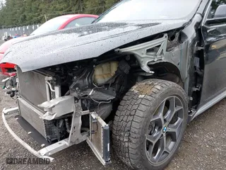 2018 BMW X1 xDrive28i with VIN WBXHT3C39J3H30531, listed as a IAAI auction lot 41890734 with 59,147 mi miles. Bid and sale history available at carsss.com. Image 20.
