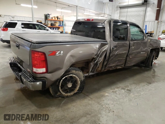 2012 GMC Sierra 1500 SLE with VIN 3GTP2VE73CG227453, listed as a Copart auction lot 52871865 with 133,419 mi miles and Salvage Title. Bid and sale history available at DreamBid. Image 3.