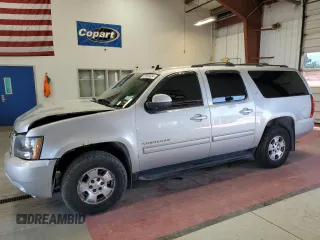 2014 Chevrolet Suburban LT with VIN 1GNSKJE77ER120211, listed as a Copart auction lot 62469424 with 213,282 mi miles and Salvage Title. Bid and sale history available at carsss.com. Image 1.