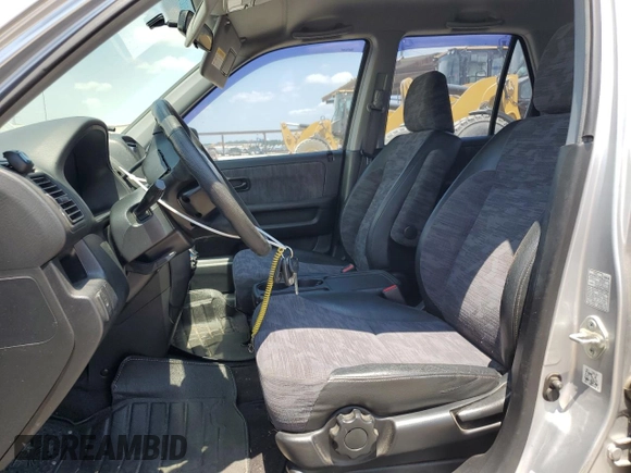 2002 Honda CR-V LX with VIN JHLRD68512C025394, listed as a Copart auction lot 67161964 with 143,660 mi miles and Salvage Title. Bid and sale history available at DreamBid. Image 7.