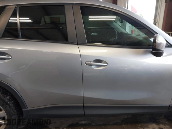 2015 Mazda CX-5 Sport z VIN JM3KE2BE8F0434889, wystawiony jako IAAI lot #42259894 z przebiegiem 298 835 mil mil oraz . Historia ofert i sprzedaży dostępna na DreamBid. Obrazek 13.