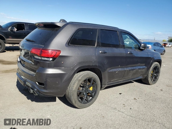 2018 Jeep Grand Cherokee Trackhawk with VIN 1C4RJFN96JC377074, listed as a Copart auction lot 53305975 with 27,625 mi miles and Salvage title. Bid and sale history available at DreamBid. Image 3.