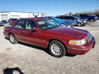 1998 Ford Crown Victoria LX with VIN 2FAFP74W4WX118422, listed as a Copart auction lot 78716184 with 70,214 mi miles and Salvage Title. Bid and sale history available at carsss.com. Image 4.