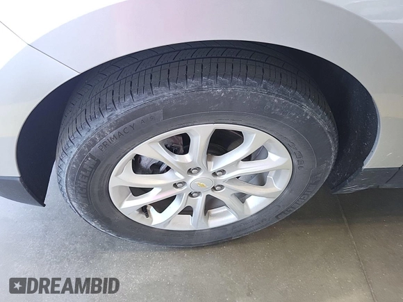 2020 Chevrolet Equinox LT with VIN 2GNAXJEV0L6236404, listed as a IAAI auction lot 42619695 with 77,124 mi miles and . Bid and sale history available at DreamBid. Image 9.