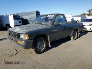 1992 Toyota Pickup z VIN 4TARN81A6NZ035414, wystawiony jako Copart lot #89213935 z przebiegiem 108 410 mil mil oraz Czysty tytuł • Clean title. Historia ofert i sprzedaży dostępna na DreamBid. Obrazek 1.