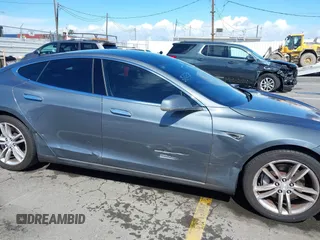2014 Tesla Model S 60 with VIN 5YJSA1S15EFP29010, listed as a IAAI auction lot 41798180 with 142,754 mi miles and . Bid and sale history available at DreamBid. Image 6.