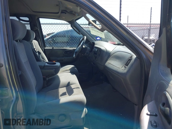 2003 Ford F-150 XLT with VIN 1FTRW07L63KA65904, listed as a IAAI auction lot 41983556 with 166,086 mi miles. Bid and sale history available at carsss.com. Image 5.