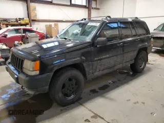 1998 Jeep Grand Cherokee Laredo with VIN 1J4GZ58Y9WC122076, listed as a Copart auction lot 84221784 with 387,353 mi miles and Salvage Title. Bid and sale history available at carsss.com. Image 1.