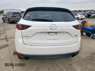 2018 Mazda CX-5 Touring z VIN JM3KFACM0J0469433, wystawiony jako Copart lot #54349955 z przebiegiem Nie podano mil oraz Szkoda całkowita • Salvage title. Historia ofert i sprzedaży dostępna na DreamBid. Obrazek 6.