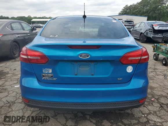 2016 Ford Focus SE z VIN 1FADP3F21GL400767, wystawiony jako Copart lot #52174835 z przebiegiem 141 264 mil mil oraz Szkoda całkowita • Salvage title. Historia ofert i sprzedaży dostępna na DreamBid. Obrazek 6.