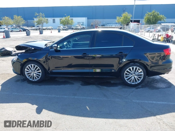 2015 Volkswagen Jetta Sedan 1.8T SE w/Connectivity with VIN 3VWD07AJ6FM354397, listed as a IAAI auction lot 41772983 with 100,265 mi miles. Bid and sale history available at carsss.com. Image 14.