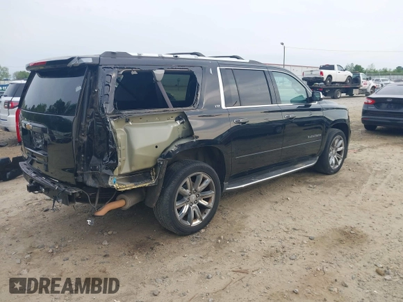 2015 Chevrolet Suburban LTZ with VIN 1GNSCKKCXFR731873, listed as a IAAI auction lot 42069917 with 108,963 mi miles and . Bid and sale history available at DreamBid. Image 4.