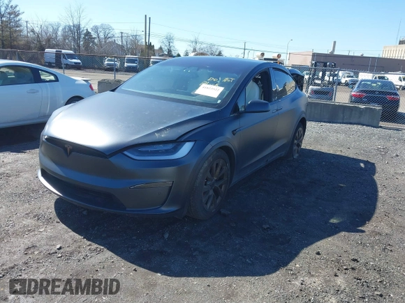 2022 Tesla Model X with VIN 7SAXCDE52NF345835, listed as a IAAI auction lot 41823522 with 24,401 mi miles and . Bid and sale history available at DreamBid. Image 2.