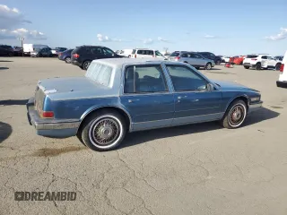 1988 Cadillac Seville z VIN 1G6KS5152JU809989, wystawiony jako Copart lot #51385205 z przebiegiem 40 217 mil mil oraz Czysty tytuł • Clean title. Historia ofert i sprzedaży dostępna na DreamBid. Obrazek 3.