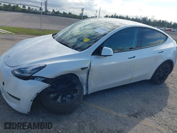 2023 Tesla Model Y Long Range z VIN 7SAYGDEE0PA128888, wystawiony jako IAAI lot #41410085 z przebiegiem 12 578 mil mil oraz . Historia ofert i sprzedaży dostępna na DreamBid. Obrazek 6.
