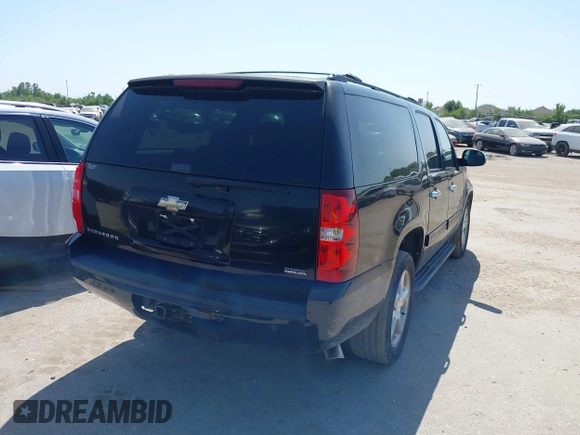 2011 Chevrolet Suburban LT with VIN 1GNSCJE09BR235355, listed as a IAAI auction lot 42030105 with 308,576 mi miles. Bid and sale history available at carsss.com. Image 4.