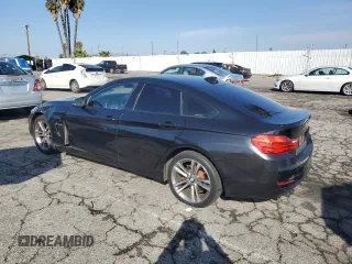 2015 BMW 4 Series 428i with VIN WBA4A5C57FD410621, listed as a Copart auction lot 42754235 with 122,822 mi miles and Salvage Title. Bid and sale history available at carsss.com. Image 2.