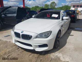 2014 BMW M6 with VIN WBS6C9C50EDV73809, listed as a IAAI auction lot 41648991 with 68,054 mi miles. Bid and sale history available at carsss.com. Image 2.