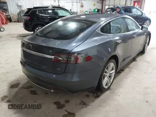 2014 Tesla Model S 60 with VIN 5YJSA1H16EFP52853, listed as a IAAI auction lot 41941989 with 132,038 mi miles and . Bid and sale history available at DreamBid. Image 4.