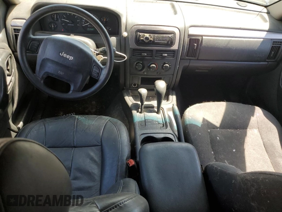 2004 Jeep Grand Cherokee Laredo with VIN 1J4GW48S34C343281, listed as a Copart auction lot 63253325 with 247,697 mi miles and Clean title. Bid and sale history available at DreamBid. Image 8.
