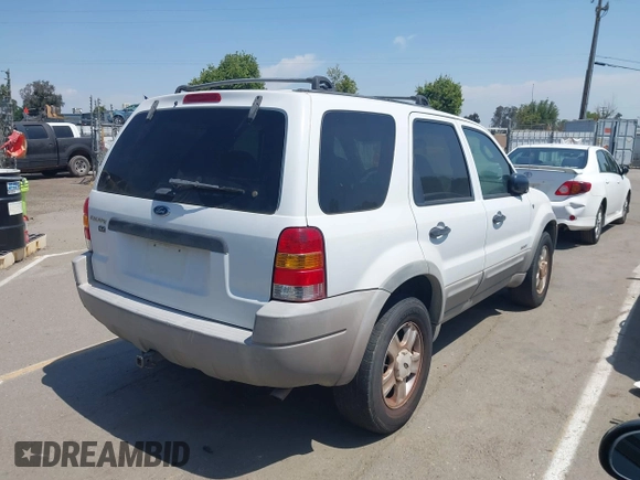 2001 Ford Escape XLT with VIN 1FMYU04131KB70753, listed as a IAAI auction lot 42174549 with 209,485 mi miles and . Bid and sale history available at DreamBid. Image 4.