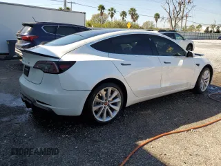 2020 Tesla Model 3 Standard Range Plus with VIN 5YJ3E1EA6LF661513, listed as a Copart auction lot 47008985 with 128,362 mi miles and Non Repairable. Bid and sale history available at DreamBid. Image 3.