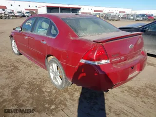 2015 Chevrolet Impala Limited LTZ with VIN 2G1WC5E36F1163985, listed as a IAAI auction lot 41525458 with 154,146 mi miles. Bid and sale history available at carsss.com. Image 3.