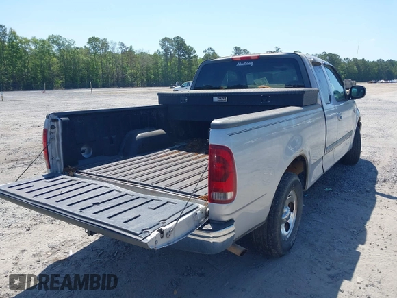 2003 Ford F-150 XL with VIN 1FTRX17W43NA77481, listed as a IAAI auction lot 42155310 with 230,322 mi miles. Bid and sale history available at carsss.com. Image 4.
