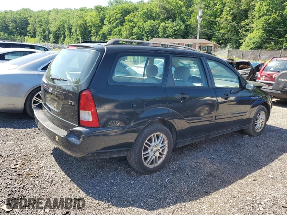 2004 Ford Focus ZTW with VIN 1FAFP35Z84W203676, listed as a Copart auction lot 57272835 with 183,115 mi miles and Salvage title. Bid and sale history available at DreamBid. Image 3.