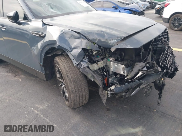 2025 Mazda CX-70 Premium Plus with VIN JM3KJEHA3S1126454, listed as a IAAI auction lot 42427454 with 5,648 mi miles and . Bid and sale history available at DreamBid. Image 6.