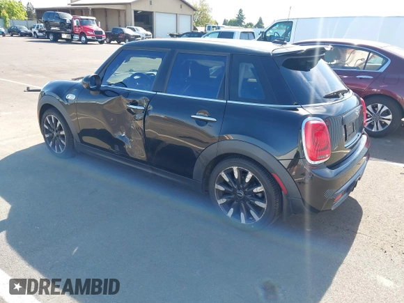 2015 MINI Hardtop 4 Door S z VIN WMWXU3C58F2B57218, wystawiony jako IAAI lot #42361437 z przebiegiem 96 984 mil mil oraz . Historia ofert i sprzedaży dostępna na DreamBid. Obrazek 3.