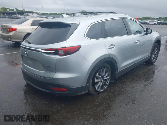 2020 Mazda CX-9 Touring with VIN JM3TCBCY8L0400787, listed as a IAAI auction lot 42188981 with 86,459 mi miles and . Bid and sale history available at DreamBid. Image 4.