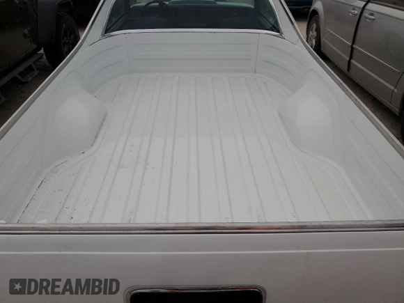 1984 Chevrolet El Camino z VIN 1GCCW80H7ER173291, wystawiony jako Copart lot #76606244 z przebiegiem Nie podano mil oraz Szkoda całkowita • Salvage title. Historia ofert i sprzedaży dostępna na DreamBid. Obrazek 10.