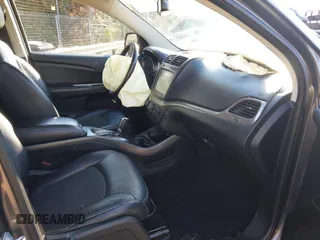 2014 Dodge Journey Crossroad z VIN 3C4PDDGG9ET302345, wystawiony jako IAAI lot #41888259 z przebiegiem 104 980 mil mil oraz . Historia ofert i sprzedaży dostępna na DreamBid. Obrazek 5.