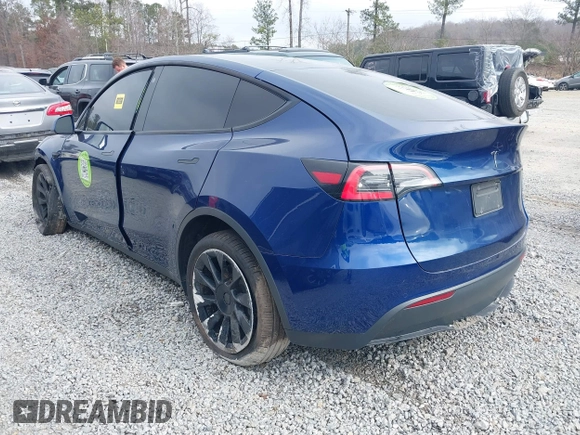 2021 Tesla Model Y Standard Range with VIN 5YJYGDED8MF122985, listed as a IAAI auction lot 41430423 with 120,302 mi miles and . Bid and sale history available at carsss.com. Image 3.